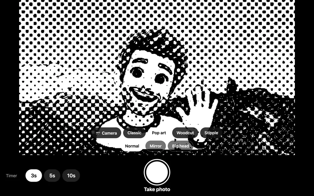 The booth's camera screen in the Pop art look: a cartoon avatar waving in front of mountains, turned into black-and-white halftone dots, with the looks and the shutter button below